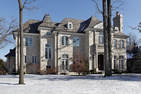 Luxury stone home in winter with front balconyの写真素材