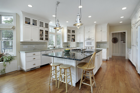 Kitchen in luxury home with large granite island.の写真素材