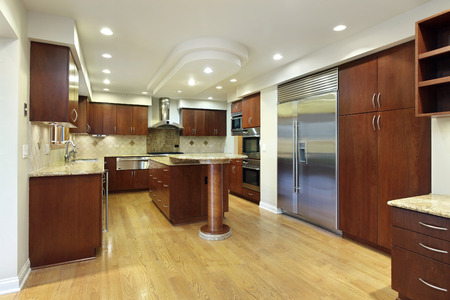 Kitchen in luxury home with double decker island.の写真素材