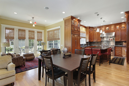 Kitchen in luxury home with eating area and family room view.の写真素材