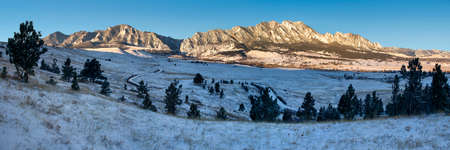Panoramic of the Boulder, Colorado foothills just after sunrise in winter.の写真素材