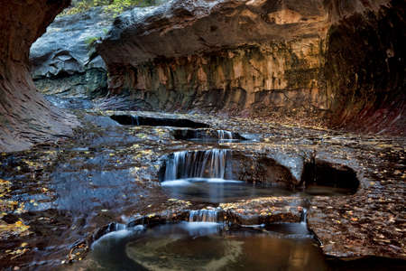 Small cascades and pools at the entrance to the Subway, a unique tunnel scuplted by the Left Fork of North Creek in Zion National Park, Utahの写真素材
