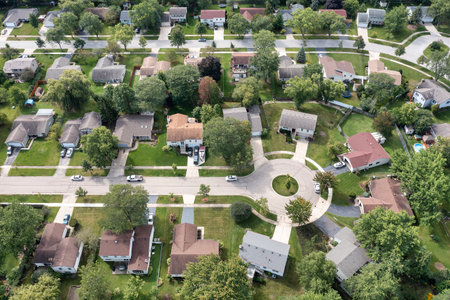Aerial view of a tree-lined neighborhood in a cul-de-sac in a Chicago suburban city in summer.の写真素材