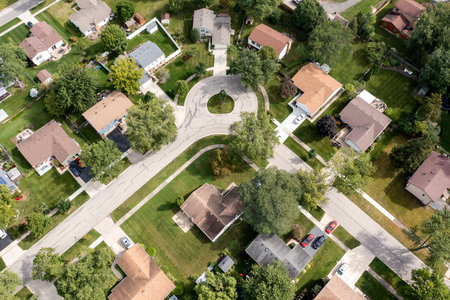 Aerial view of a tree-lined neighborhood in a cul-de-sac in a Chicago suburban city in summer.の写真素材