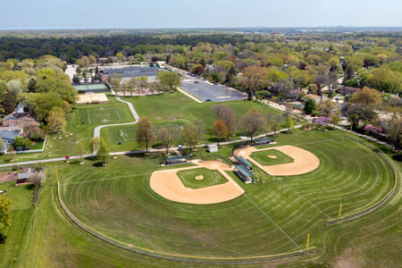 Aerial view of a large playfield in a suburban neighborhood with ballfields, tennis courts, and soccer fields.の写真素材