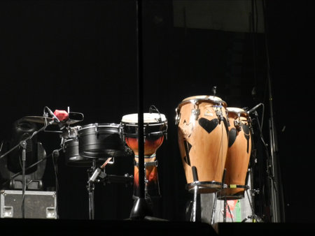 Various musical instruments arranged on a stage with a black background.の写真素材