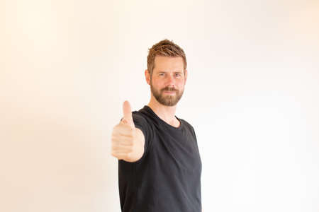 Young man with a thumbs up