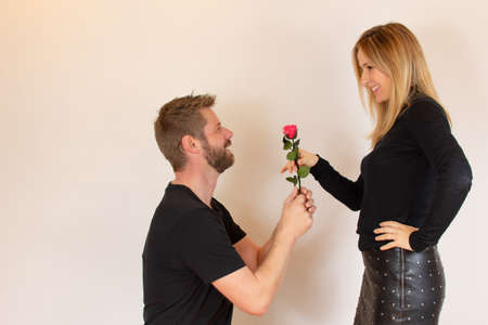 Romantic couple receiving a roseの写真素材