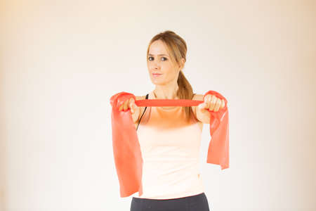 Smiling young woman at the gym