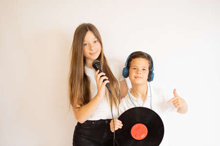 Two smiling friends enjoying musicの写真素材