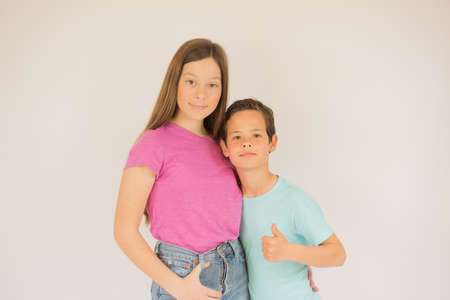 Beautiful boy and girl looking into camera