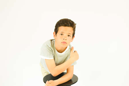 Young boy making gesture with his handsの写真素材