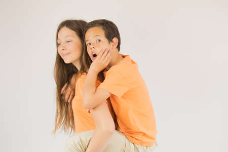 Boy and girl are looking into the cameraの写真素材