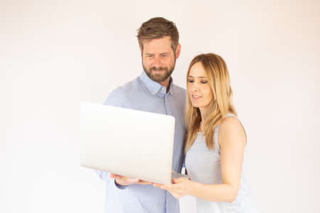 handsome couple is looking at their laptopの写真素材