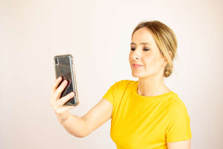 Healthy beautiful woman smiling to her phone
