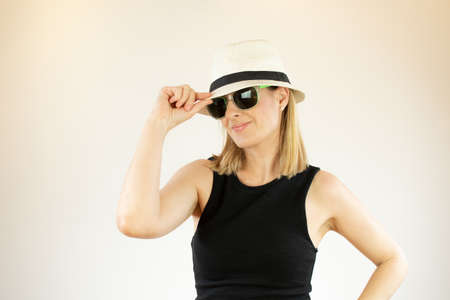 Pretty woman with hat and sunglassesの写真素材