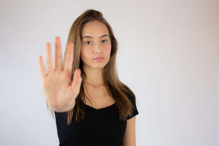 Pretty young girl making stop hand gestureの写真素材