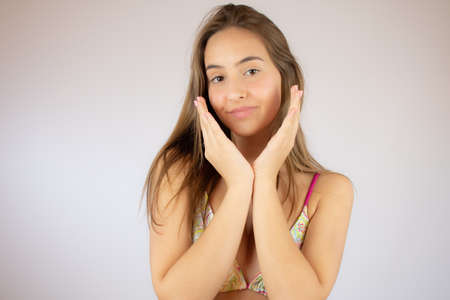 Beautiful young girl in bikini smilingの写真素材