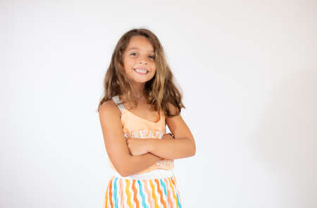 Beautiful little girl on white background smiling