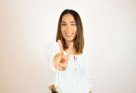 Beautiful young woman in white shirt smilingの写真素材