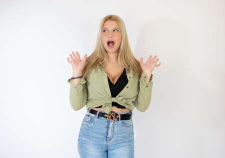 Blonde girl in green blouse on white backgroundの写真素材