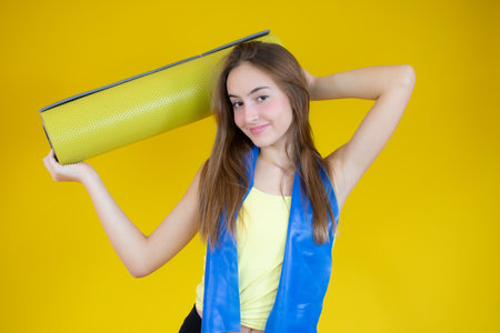Portrait of surprised girl with mouth open standing isolated on a blue backgroundの写真素材
