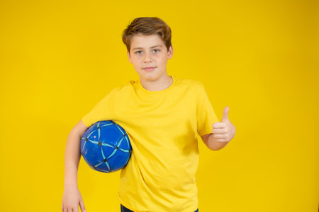 Boy in orange t-shirt preparing to dive over white background.