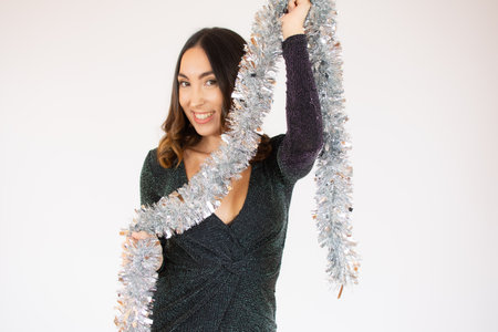 Happy New Year to you. One young and beautiful woman dancing with glass of champagne and smiling. Woman is happy about the New Yearの写真素材