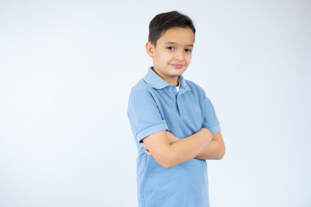 Smiling young boy with a happy gesture isolated on white backgroundの写真素材