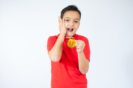 Happy expressive child i with medal isolated on white