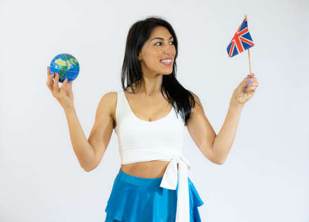 happy young travel woman holding British England flag and earth globe.