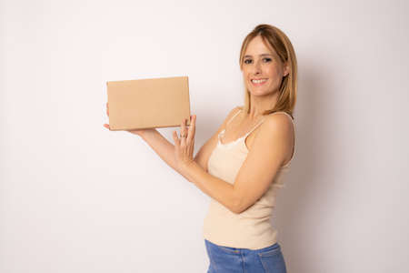 Happy young woman holding package parcel box, Delivery courier and shipping service concept