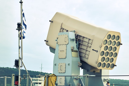 Varna, Bulgaria - Circa August 2017: Maritime city port. Fragment of a military underwater ship on the quay. Old submarine, border guards. Waves at seaのeditorial素材