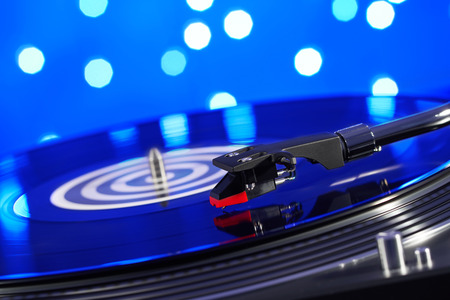 Turntable vinyl record player. Sound technology for DJ to mix & play music. Vintage vinyl record...