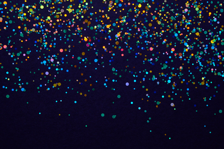Holliday background. Christmas texture for your design and text. Multicolored sweets on a dark backgroundの写真素材