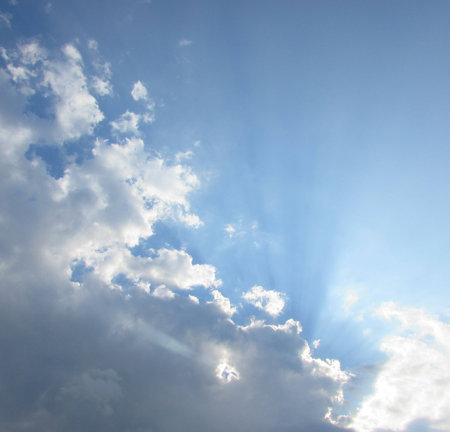 Sun breaks through cloudsの写真素材