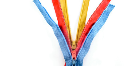 Isolated Zippers in Yellow, Blue, and Red Colorsの写真素材