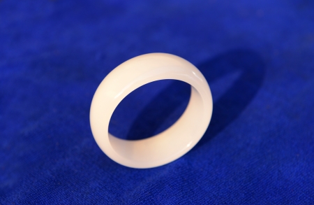 Jade bracelet isolated on a blue background の写真素材