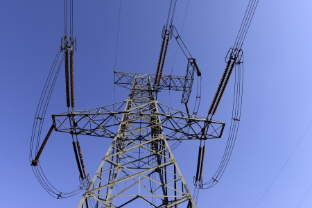 Stand high voltage towers under the blue sky 