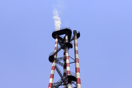 Industrial factory chimneys in the sky