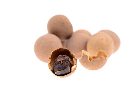 A few dried longan on a white backgroundの写真素材