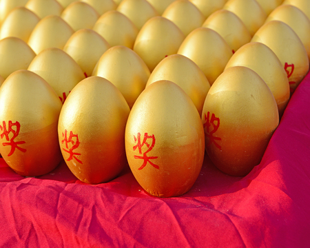 Close-up of the rows of golden eggsの写真素材