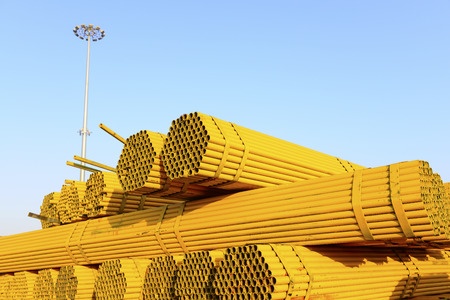 Many steel pipes stacked together の写真素材