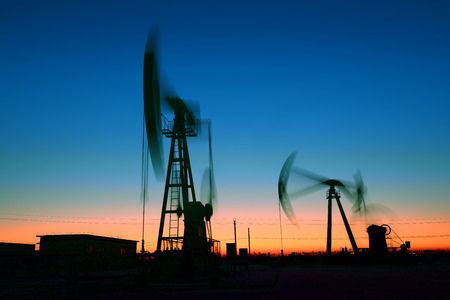 The beam pumping unit is homework, in the fields under the setting sun 