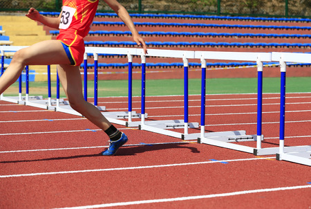 Hurdle race on the track and fieldの写真素材