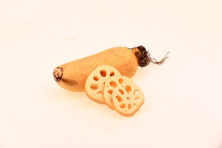 Lotus root on a white background, closeup photoの写真素材