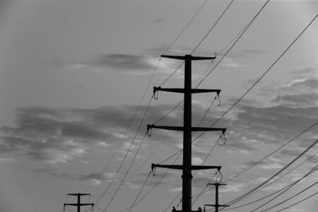 High voltage tower, silhouetted in the evening
の写真素材