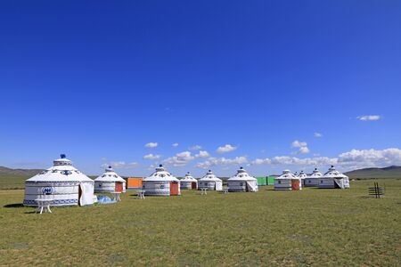 Mongolian yurt on the grassland,in the background of blue sky and white cloudsのeditorial素材