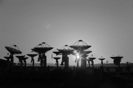 Observatory equipment, silhouette at sunriseの写真素材