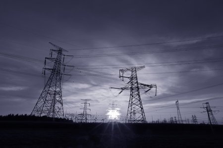 High voltage power grid, in the sunsetの写真素材